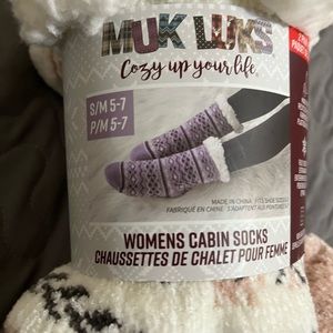 A pair of MUK LUKS cabin socks. New. Pink and white foot size 5-7 (small)